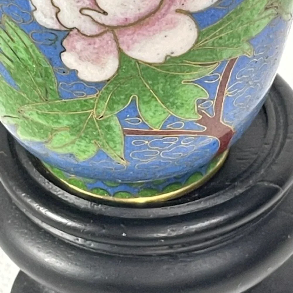 Chinese blue cloisonne and brass vase with wooden stand.